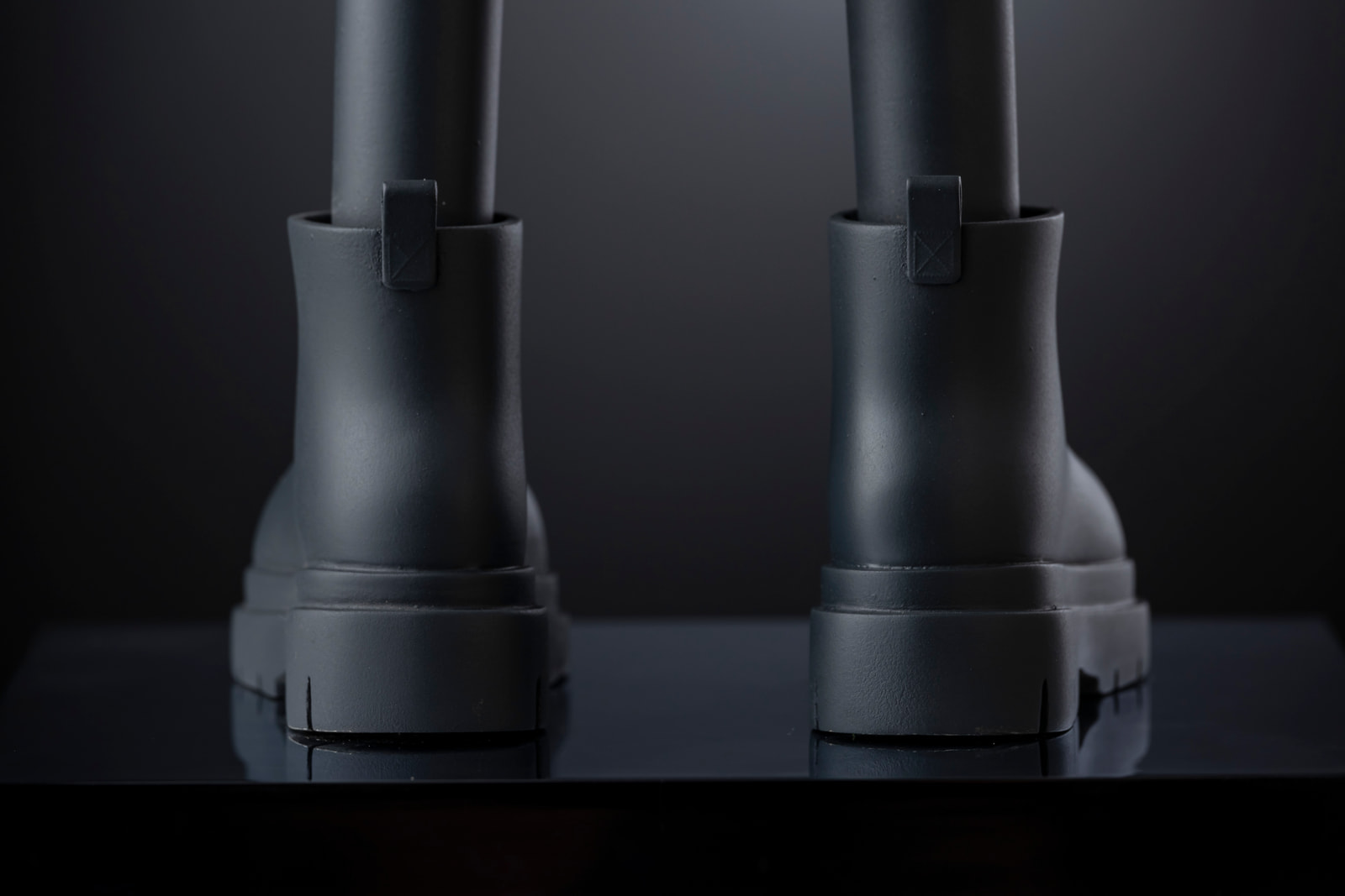 Drim 2025 — detail, boots from behind on the plinth